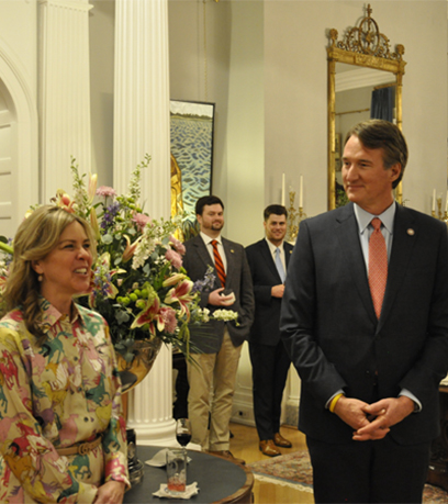 Governor Glenn Youngkin and the First Lady addressing the guests at the reception.