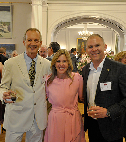 The First Lady poses between two men involved with Virginia winemaking.