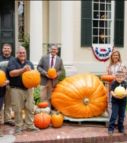 The First Lady with the Jones family holding pumpkins