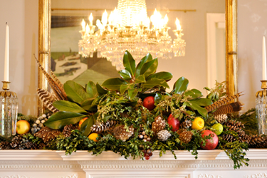 greenery on mantel with chandelier