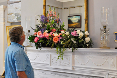 Tony Griffin (DGS) admires the arrangement he made for the Executive Mansion ballroom.