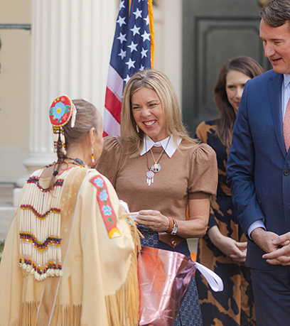 The First Lady and Governor share a moment with a Virginia Indian woman.