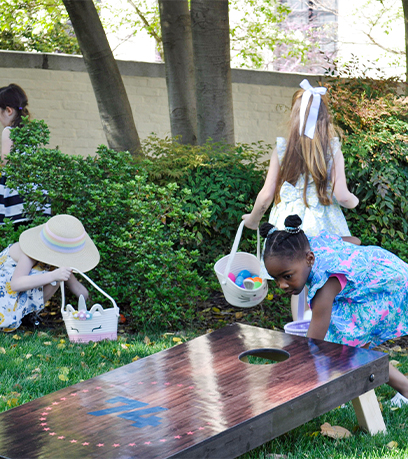 Children hunt for Easter eggs on the Executive Mansion front lawn.