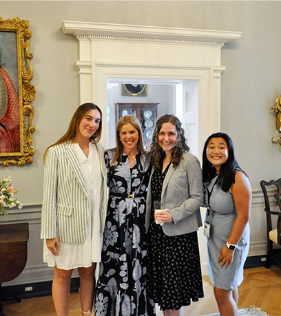 First Lady Suzanne S. Youngkin stands with three women participating in the 2023 Governor's Fellows Program inside the Executive Mansion.