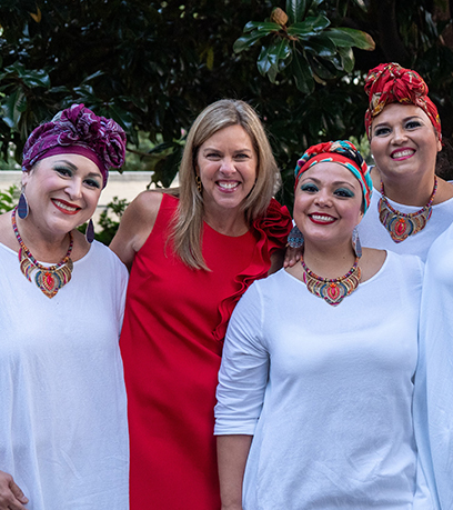 First Lady Suzanne S. Youngkin poses with members of Tradicion Dance outside the Executive Mansion.