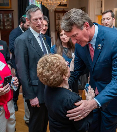 Governor shakes hands with a women