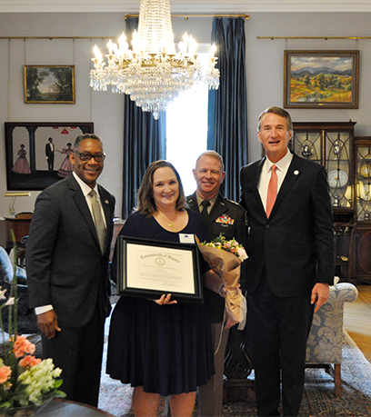 Governor and General Crenshaw pose with Major General Timothy P. Williams and wife, Cheryl Williams.