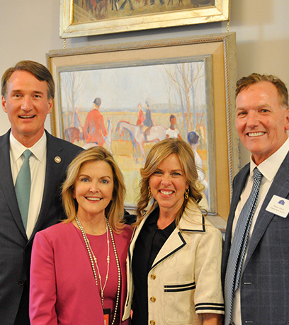 Governor Youngkin, the First Lady and Secretary Caren Merrick pose for a photo with a member of the YPO.