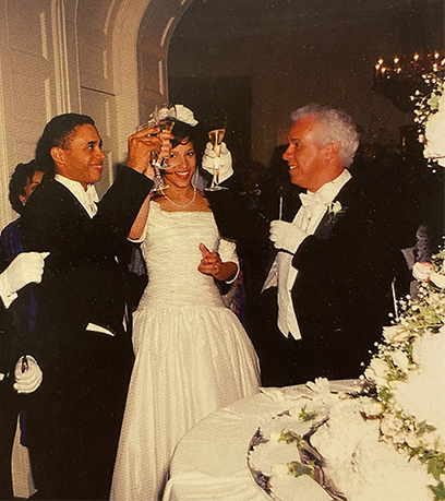 An old photo of Governor Wilder and toasting his daughter, Loren, wearing a white wedding dress.