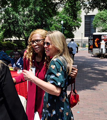 First Lady Suzanne Youngkin hugs a guest at the Mansion's Juneteenth reception