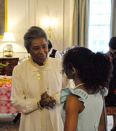 Lt. Gov. Winsome Earle-Sears has a conversation with a young girl.
