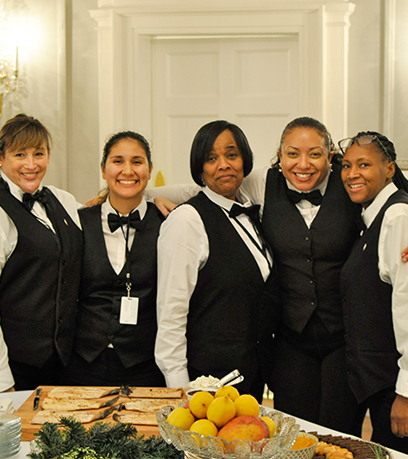 Five female staff member of the Executive Mansion team pose in the dining room.