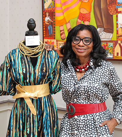 Ukay standing next to her dress.