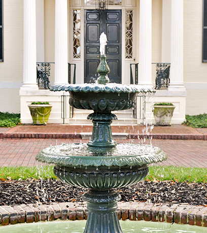 Green cast iron fountain in front of the Executive Mansion.